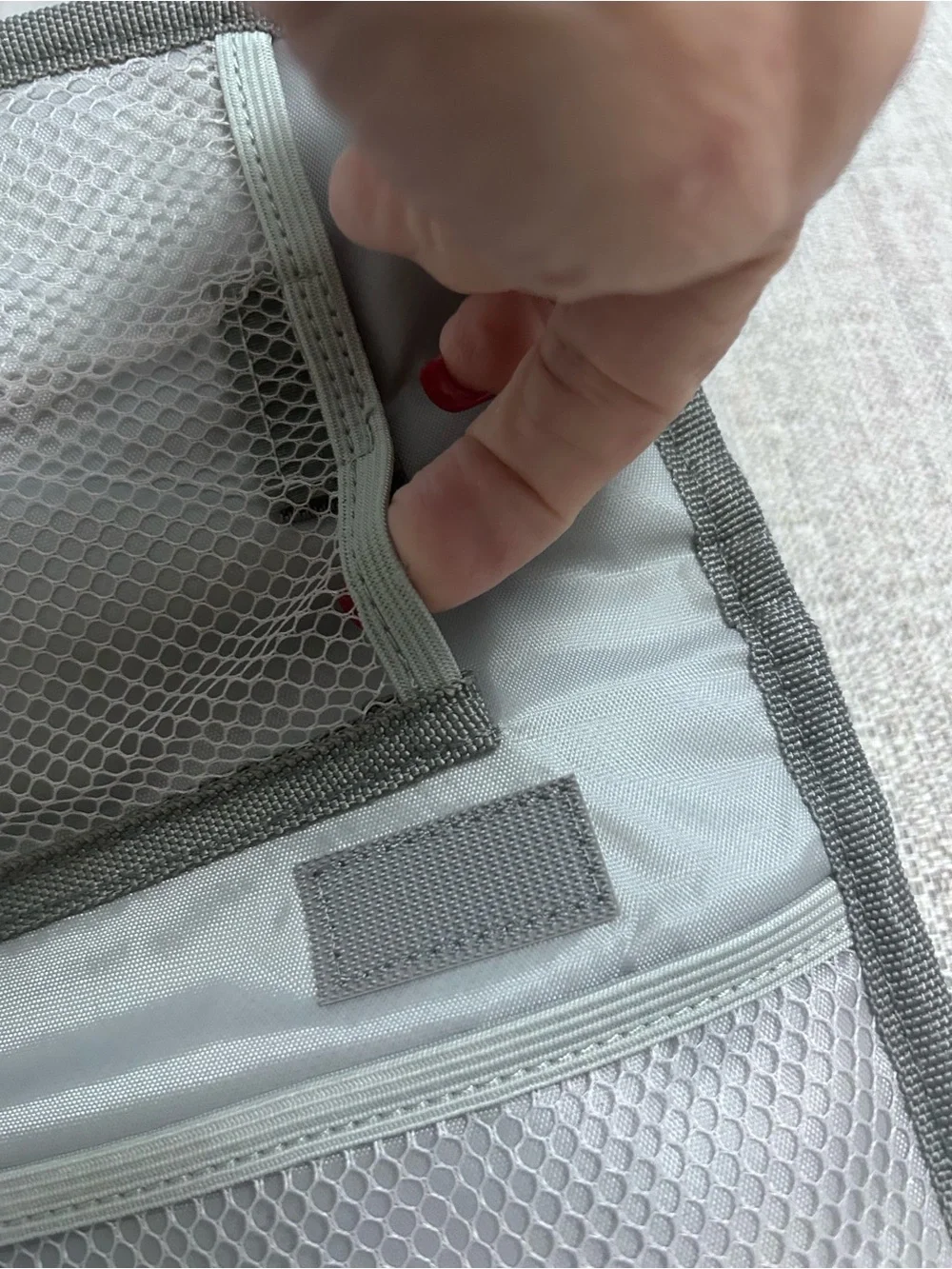 Grey Foldable Portable Changing Pad for Baby with Secure Buckle.